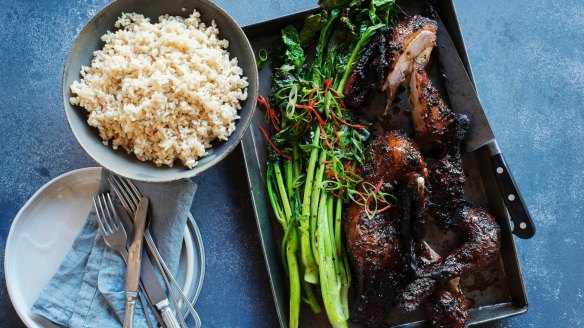 Twice-cooked sticky duck with charred Asian greens.