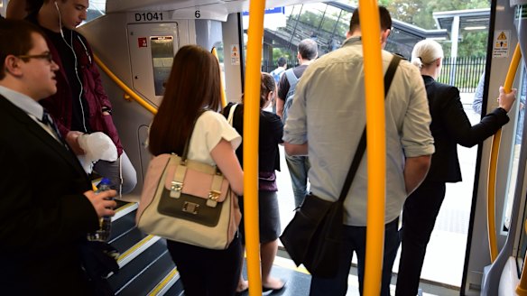 Commuters change trains at Glenfield on the new South West Rail Link on Friday. 