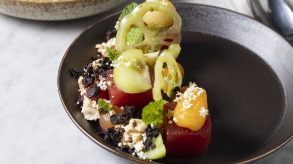 An arty salad of herb-marinated tomatoes, compressed watermelon,  dehydrated olives and shanklish.