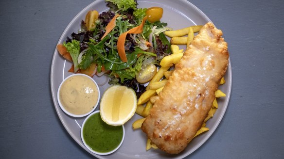 Fish and chips come with a mushy pea sauce.