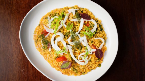 Saffron risotto, cuttlefish, cherry tomato and sea vegetables.