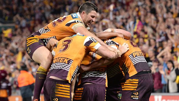 On a roll: Broncos players celebrate at the final whistle.