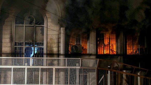 Smoke billows from the windows of the burning Saudi Arabian embassy in Tehran following a protest by Iranian activists.