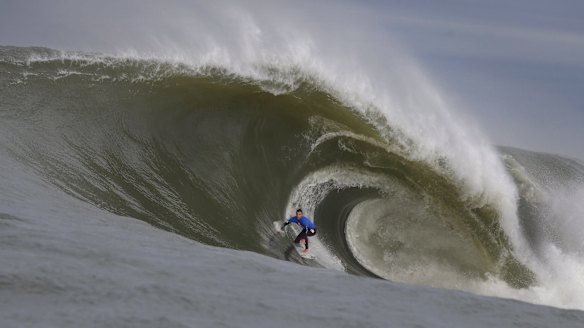 Evan Faulks rides a wave at Cape Fear, off the coast of Kurnell.