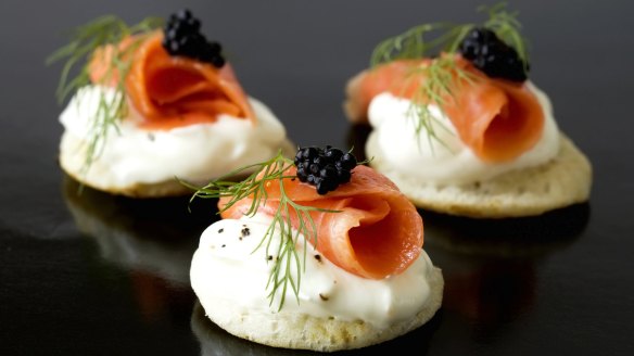 Freshly sliced smoked salmon tastes best on  blinis.