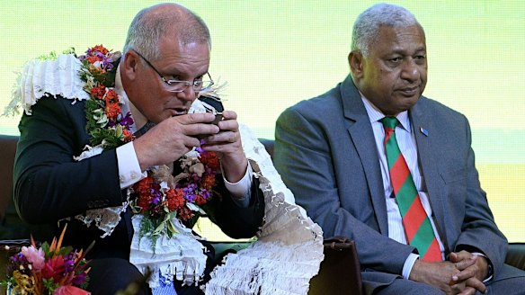 Scott Morrison attends a traditional ceremony of welcome with the Prime Minister of Fiji Frank Bainimarama in Suva.