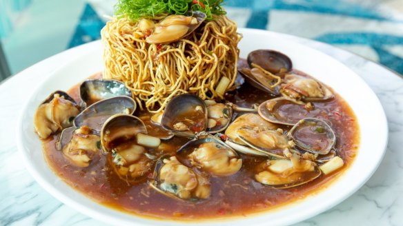 Stir-fried clams with XO sauce and crispy noodles.