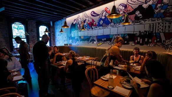 A Last Supper-style mural dominates the upstairs dining room at Paski Sopra.