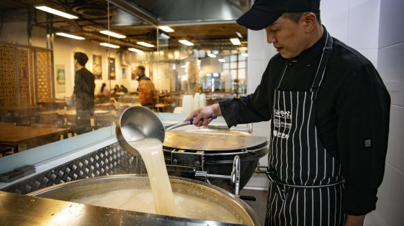 Head chef Sungjun Kim preparing bone broth at Hansang. 