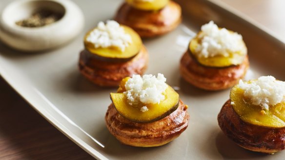 Wallaby pies topped with bread and butter pickles. 