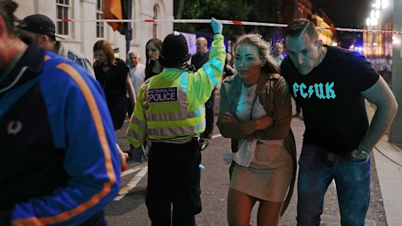 Members of the public are led away from the scene near London Bridge after the attack.