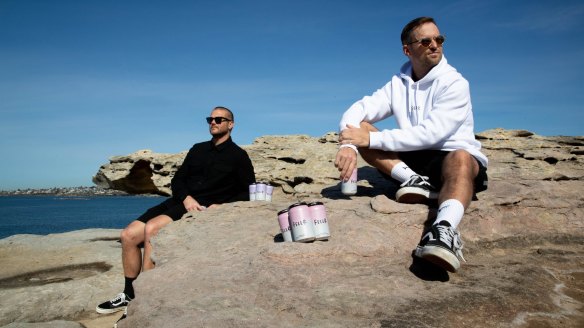 Founders of Fellr Andy Skora (left) and Will Morgan, with their seltzer cans in Sydney. 