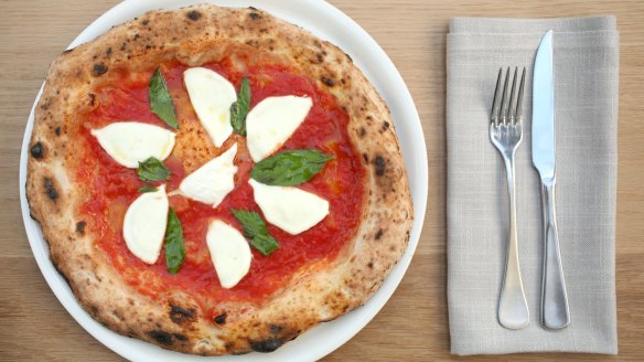 Go-to dish: Buffalo mozzarella pizza with fresh basil and San Marzano tomatoes.