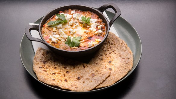 South African chakalaka-style baked eggs with flatbread.
