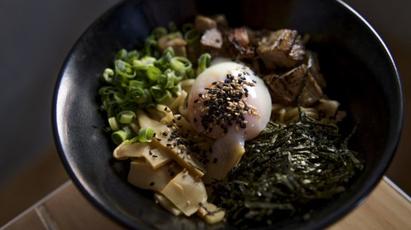 The original mazesoba includes chunks of house-made pork belly chashu, a runny onsen egg and a dusting of spring onion.
