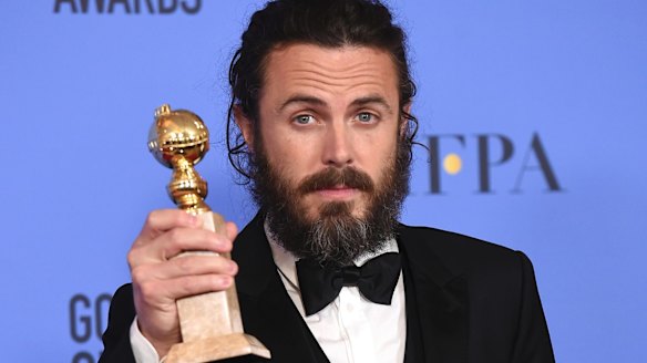 Casey Affleck poses with his Golden Globe earlier this month.