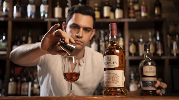 Wild Rover bartender Alex Gondzioulis pours an Australian Morris Single Malt Whisky.