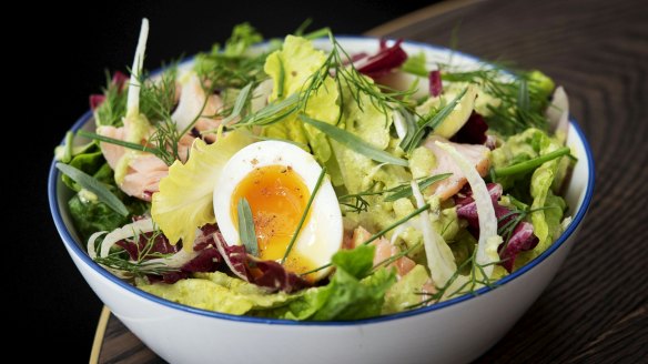 Slow-cooked salmon baby gem soft-boiled egg salad. 