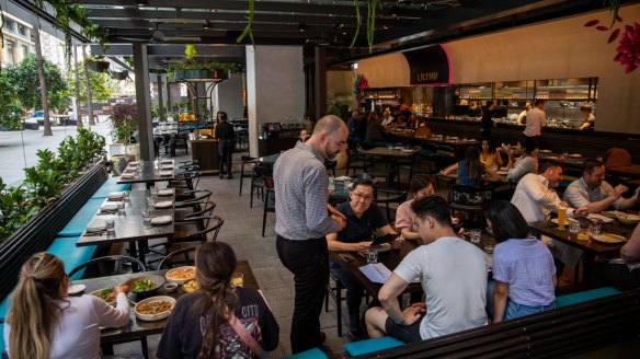 Open-air undercover tables at Lilymu in Parramatta Square. 