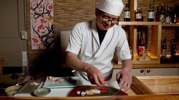 Chef Yuji Matsuzaki prepares sushi.
