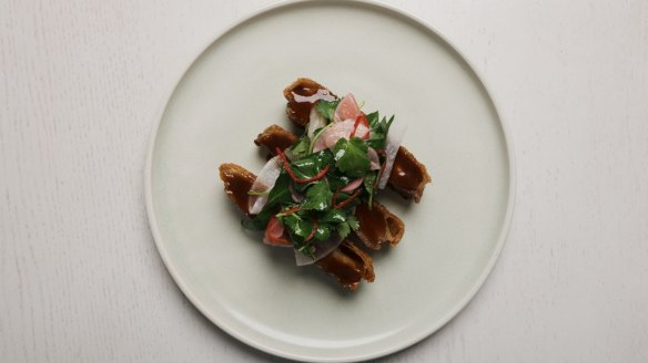 Crispy pork jowl, soy, ginger and pickled pineapple.