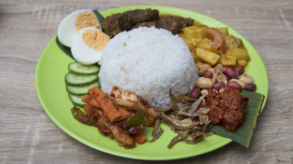 Nasi lemak with two sides, vegetable curry and beef rendang.