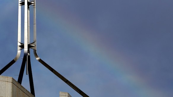 A rainbow forms over Parliament House in Canberra ahead of the Liberal party room meeting.