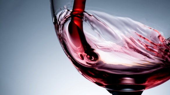 Stream of wine being pouring into a glass closeup. Downloaded under the Good Food team account (contact syndication for reuse permissions).