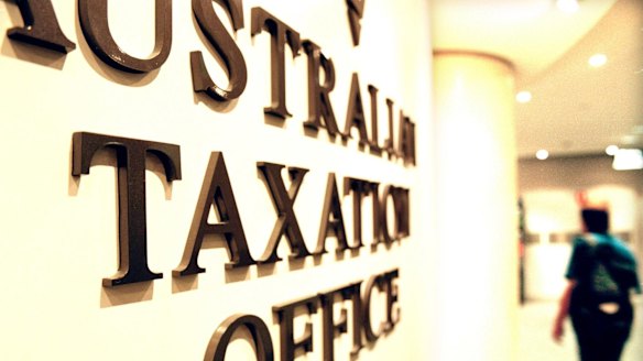 The Tax Office is fighting with the Australian Services Union over a trial of hot-desking at two offices.
