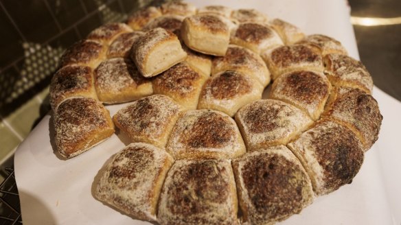 Sourdough paninis are pulled from daily baked tearable bread 'wheels'.