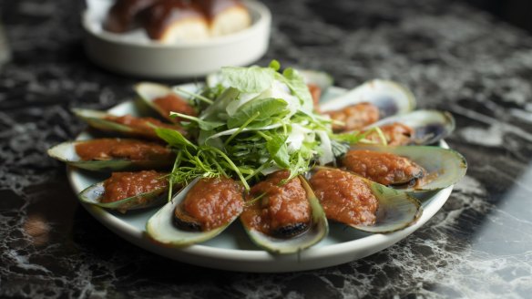 Smoked mussels, Hawaiian soft rolls, confit tomatoes. 