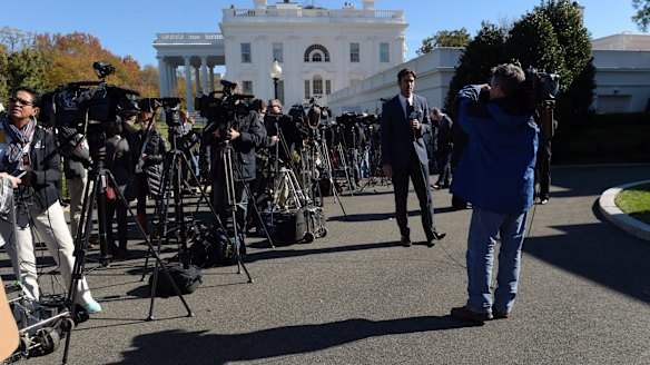 Journalists wait outside the West Wing of the White House in Washington as President Barack Obama and President-elect Donald Trump met inside. 