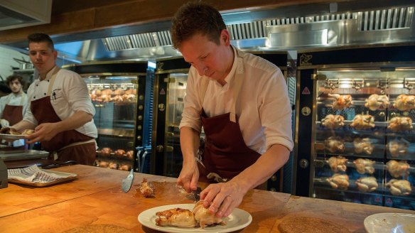 Ben Greeno preparing roast chicken at The Paddington. 