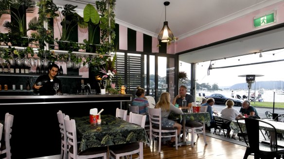 The dining room is the same shade of pink as the original Lucky Bee in NYC.