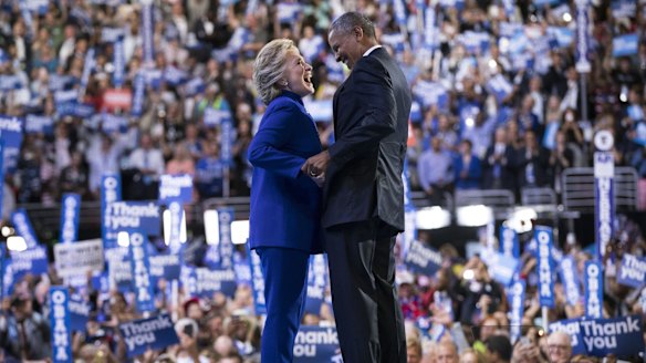 Hillary Clinton joins President Barack Obama on stage after he spoke at the Democratic National Convention in Philadelphia.