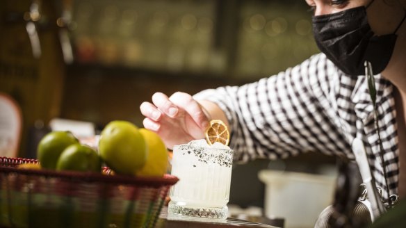 In Melbourne, Tres A Cinco manager Caitlin Surrey prepares a Tommy's margarita, one of eight that the bar offers, including some made with mezcal.