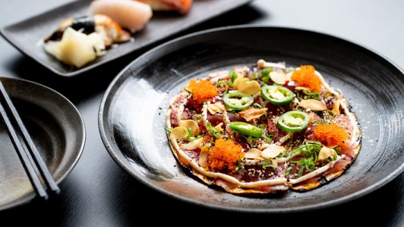 The tuna pizza is a clever kaleidoscope of colourful ingredients.