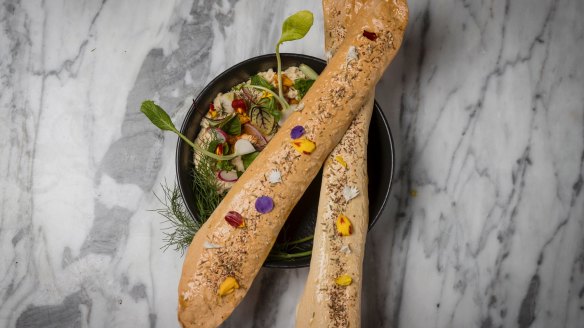 Smoked hummus with crisp-fried chickpeas, harissa, preserved lemon tahini and lavash.