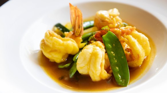 King prawns with snowpeas, zucchini and saffron and pomegranate sauce.