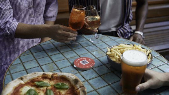 Data from the Me&u tap-and-order app shows Melbourne diners are ordering plenty of cocktails, pots of beer and chicken parmas after lockdown, as well as leaving tips for staff.