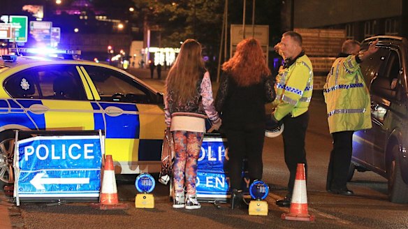 Police at Manchester Arena after reports of an explosion.