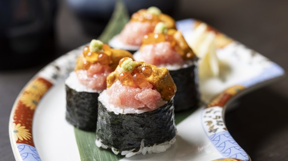 Boom roll piled high with tuna belly, creamy sea urchin and salmon roe.