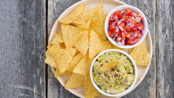 Mexicans never dip their corn chips into the salsa or guacamole.
