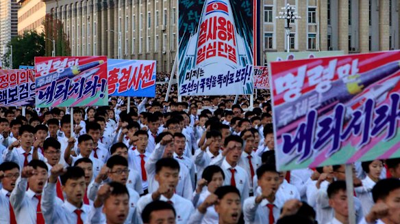 North Koreans gather at Kim Il Sung Square to attend a mass rally against America on Saturday.