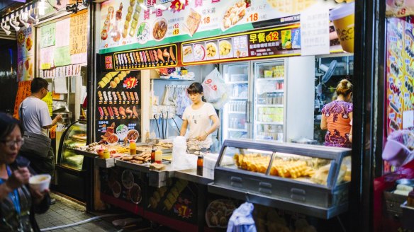 "The brighter the fluorescent lights on the hole-in-the-wall-food stand, the better the food."
