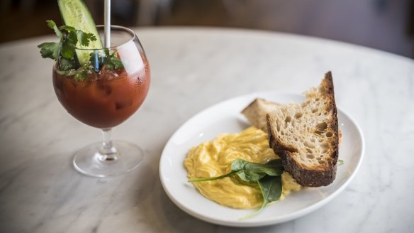 Silky scrambled eggs and sourdough toast with bills spiced Bloody Mary.