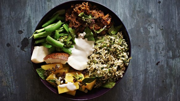 Soy and chilli pulled pork, coconut brown rice, pickled pineapple and greens recipe. Grain bowl recipes for Good Food online February 2018. Please credit Katrina Meynink.