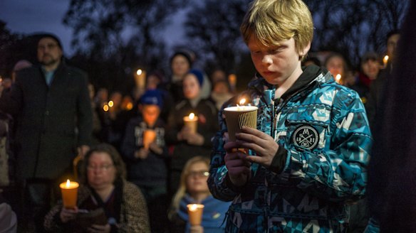 In biting wind and drizzling rain, Melburnians swamped Treasury Gardens shortly before 6pm.