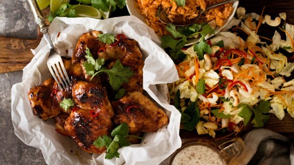 Vietnamese chicken served with red rice and coleslaw.