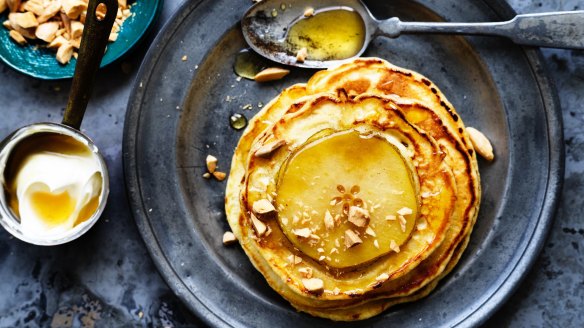 Fresh pear pancakes with almonds, sour cream and honey.